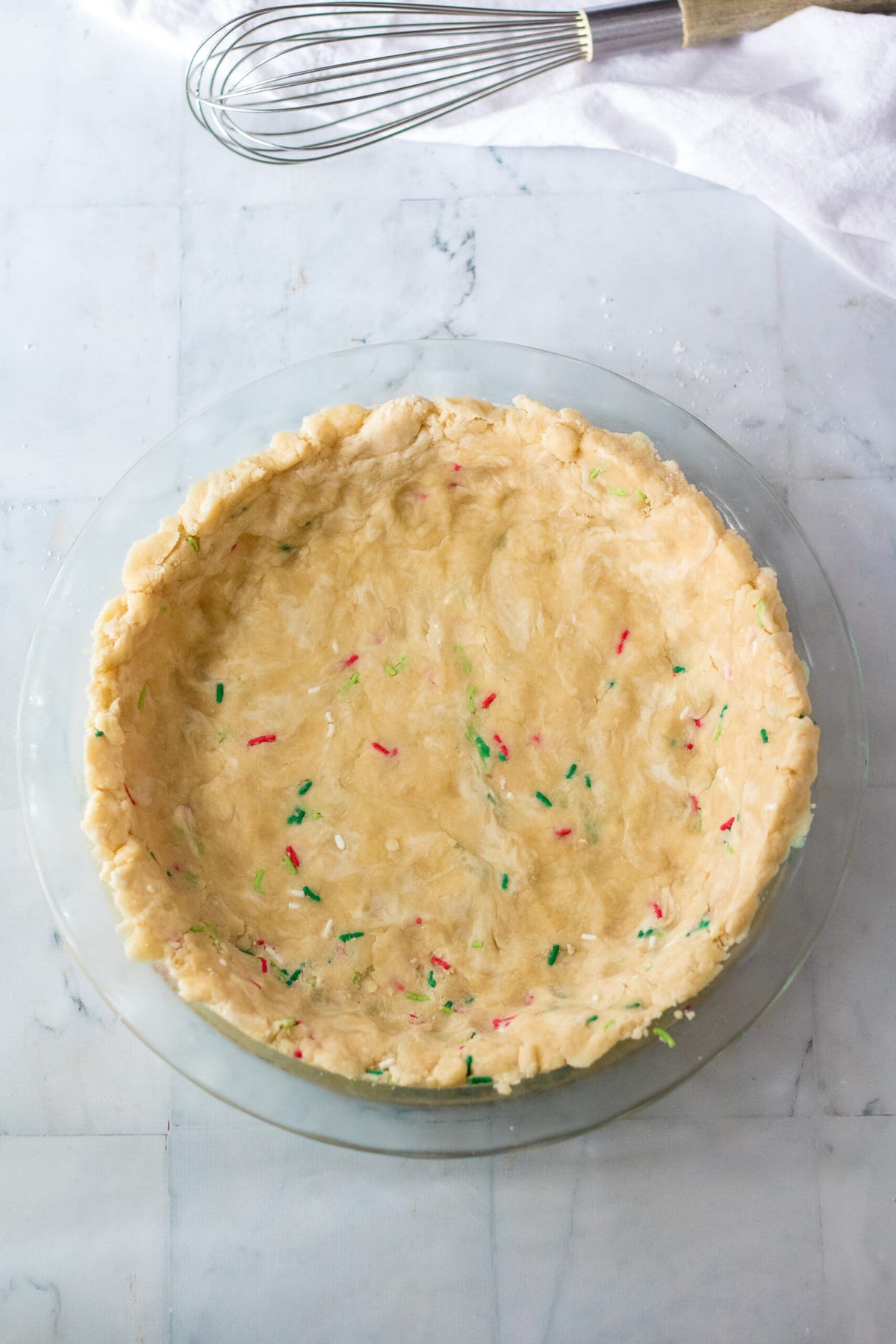 Adding the crust to the pan.