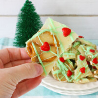 A hand holding Grinch Brittle.